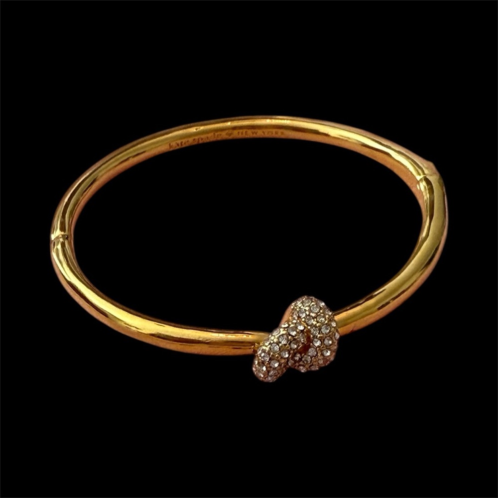 Kate Spade Gold Bangle with Crystal Accent. Full inclusion